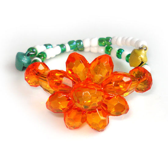 Orange flower with green and white beads children bracelet